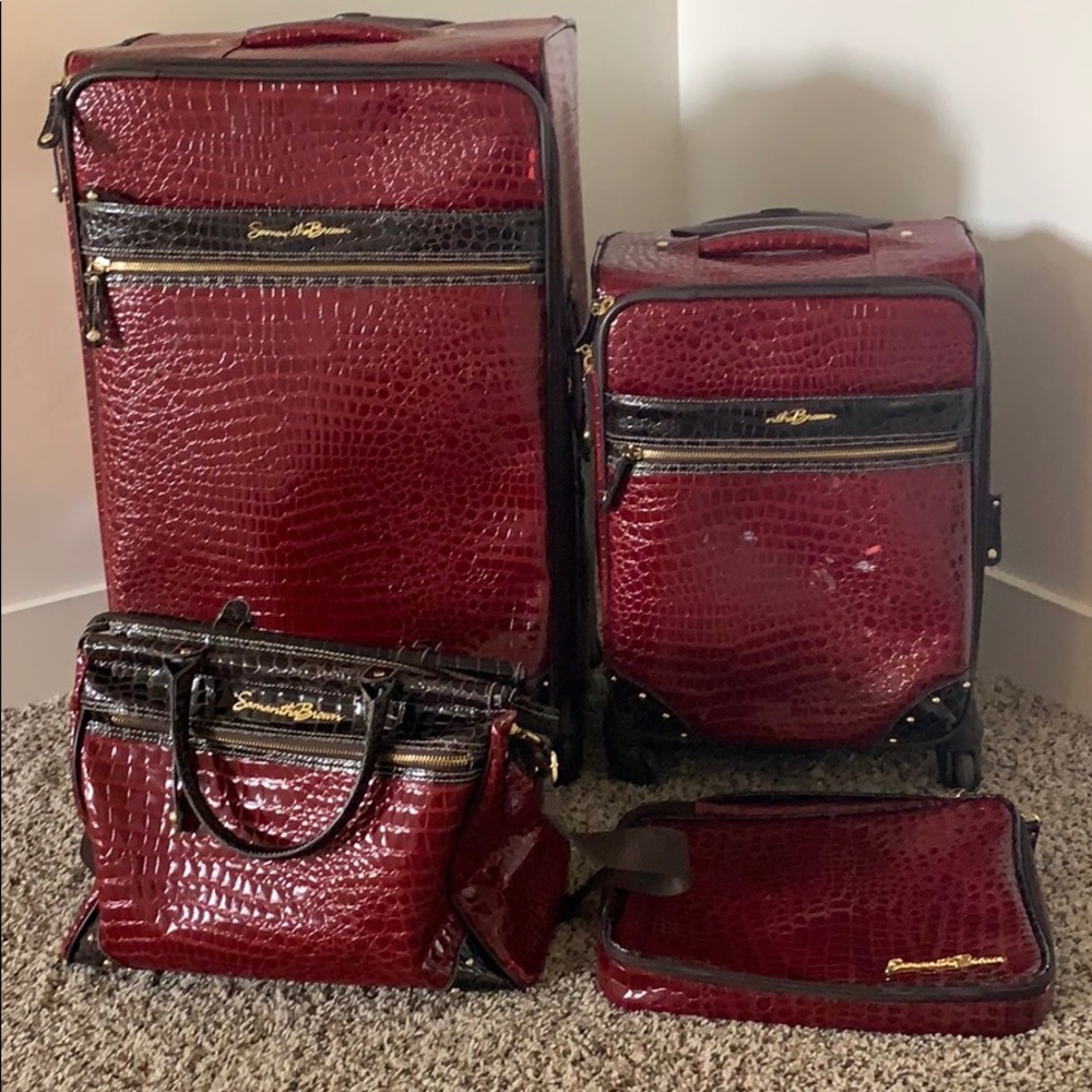Red 4 piece luggage set.